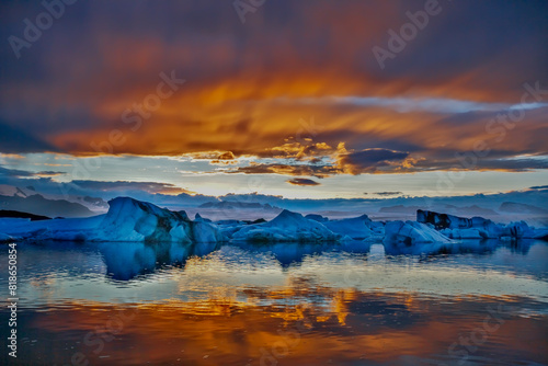 The sun sets over the famous glacier lagoon at Jokulsarlon, Iceland.