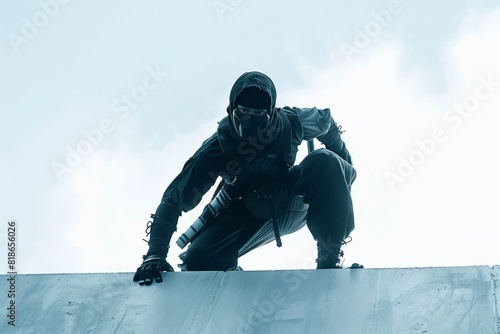A man skillfully snowboarding on top of a ramp in a snowy setting photo