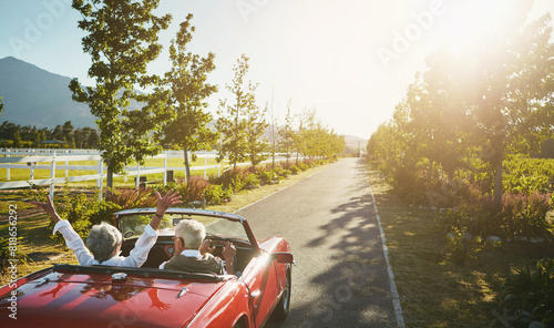 Couple, convertible and hands up for road trip celebration or travel journey in California, transportation or vacation. Old people, retirement and morning adventure or vineyard, drive or countryside