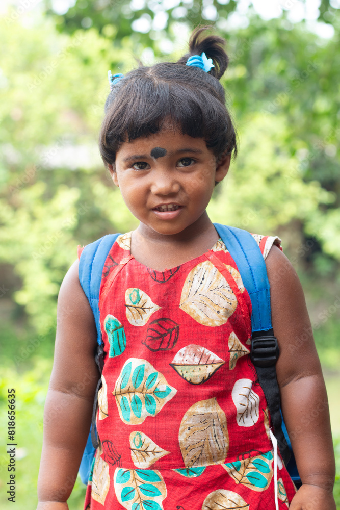 Portrait of happy indian girl with school bag standing outdoor Portrait of happy indian girl with school bag standing outdoor