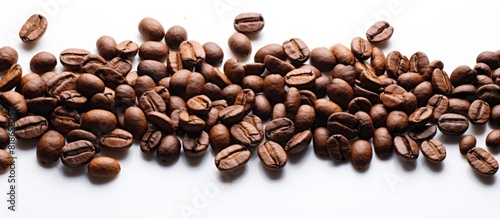 The macro image of isolated roasted coffee beans against a white background offers a textured backdrop with plenty of copy space for accompanying text