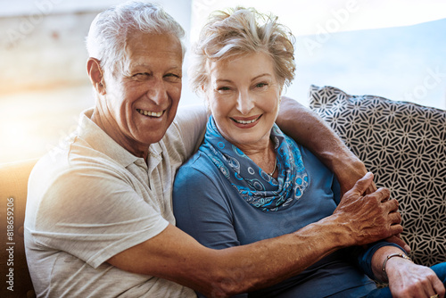 Portrait, hug and old couple on couch, love and bonding together with happiness, romance and relationship. Home, senior man or mature woman on sofa, comfort or trust with marriage, face or retirement