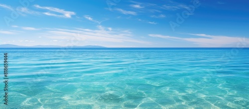 A picturesque tropical sea beneath a clear blue sky perfect for a copy space image
