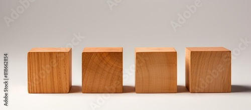 Four identical wooden cubes...