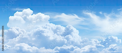 Abstract background featuring a blue sky and clouds with ample space for additional content or text