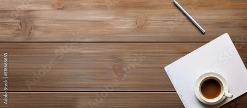 The office table is neatly arranged with a notepad computer and coffee cup on it creating a perfect view for a copy space image