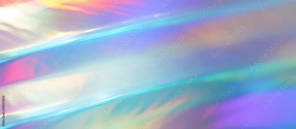 Obraz premium The image is an abstract iridescent background with a soft focus. The colors are pastel shades of pink, blue, and green. The image has a dreamy, ethereal quality.