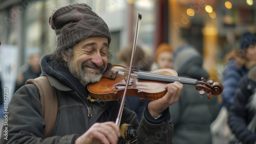 Joyful street musician playing violin with a heartfelt smile. photo