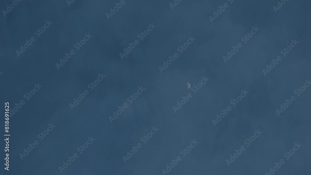 Half moon in cloudy sky. Timelapse shooting Half moon in cloudy sky. Timelapse shooting
