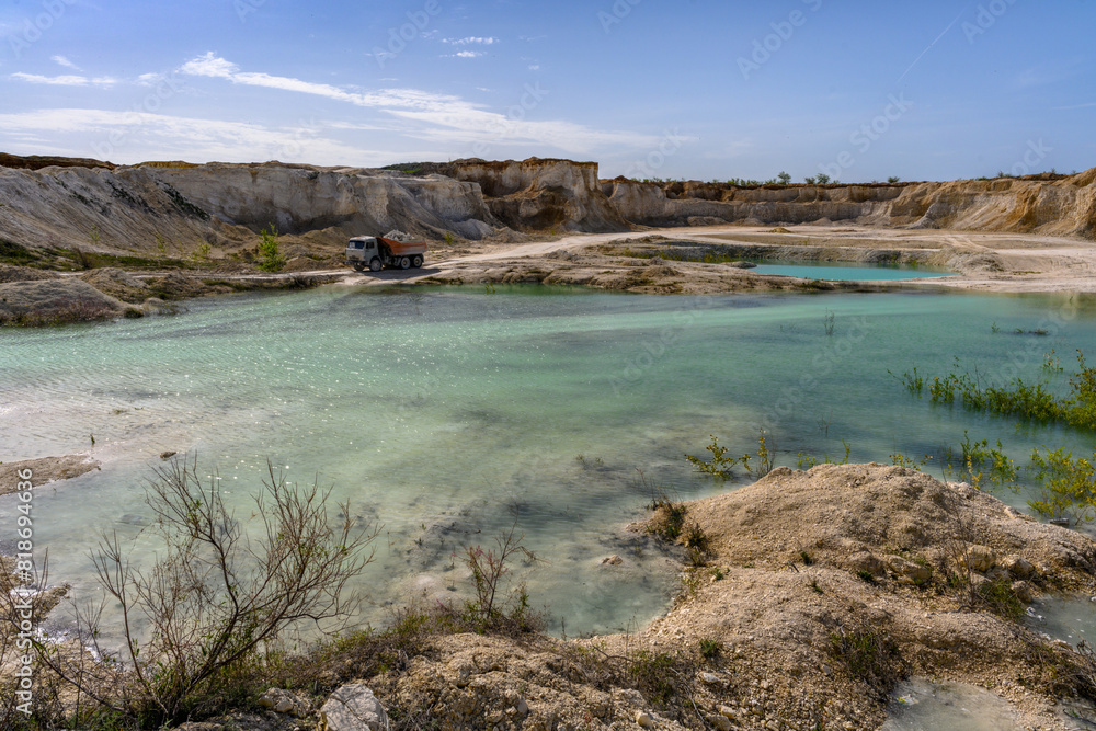 Dump trucks working and extracting the chalk in a quarry in the village of Melovye Gorki, West Kazakhstan region.