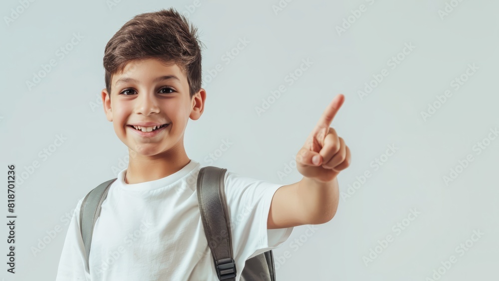 portrait of a boy on a white blank backgroud pointing his finger up in the air at something portrait of a boy on a white blank backgroud pointing his finger up in the air at something