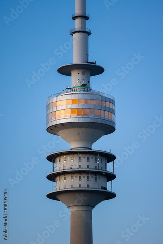 Close up photo of the Olympiaturm in Munich, Germany during sunset
