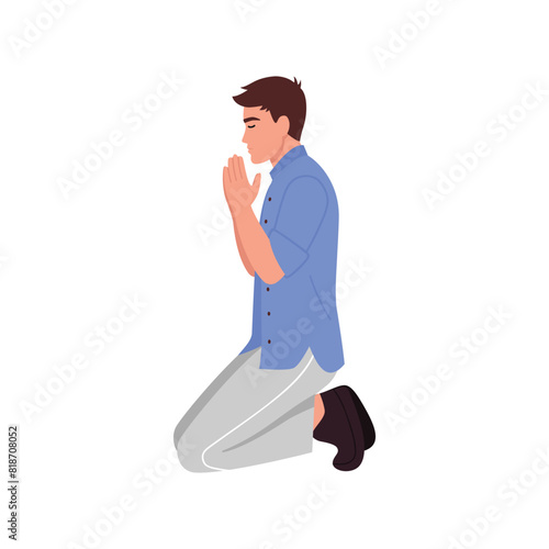 young man kneels and prays