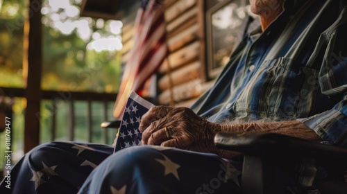 Patriotic Senior Citizen with American Flag on Porch at Dusk