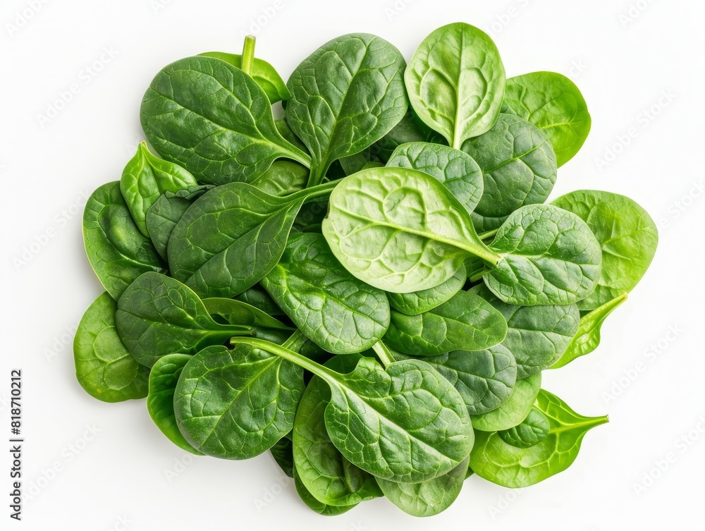 Fototapeta premium Direct above view of a spinach salad, vibrant green leaves, isolated on white
