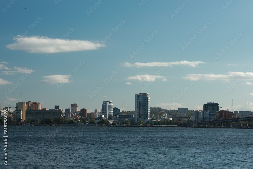 Fototapeta premium A large body of water with a city in the background