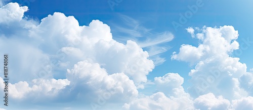 Copy space image with a background of a light blue sky and white clouds
