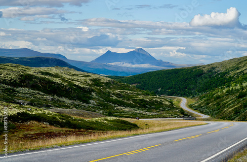 Scenic view of Venabygdsfjellet with winding road along Norwegian Scenic Route Rondane