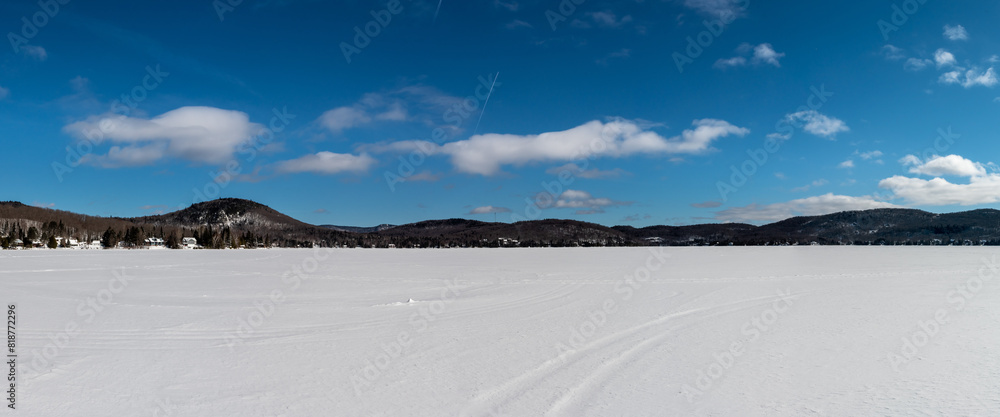 Fototapeta premium Hiking on a frozen lake in Quebec, Canada. Black Mountain Lake