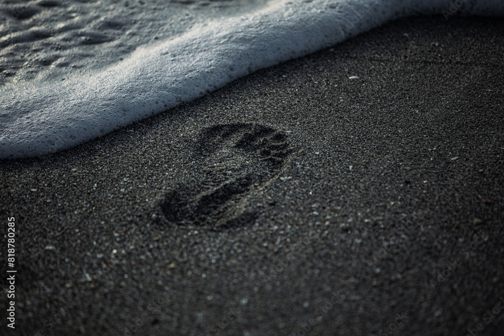 Obraz premium a photo of someones footprints in the sand and a wave