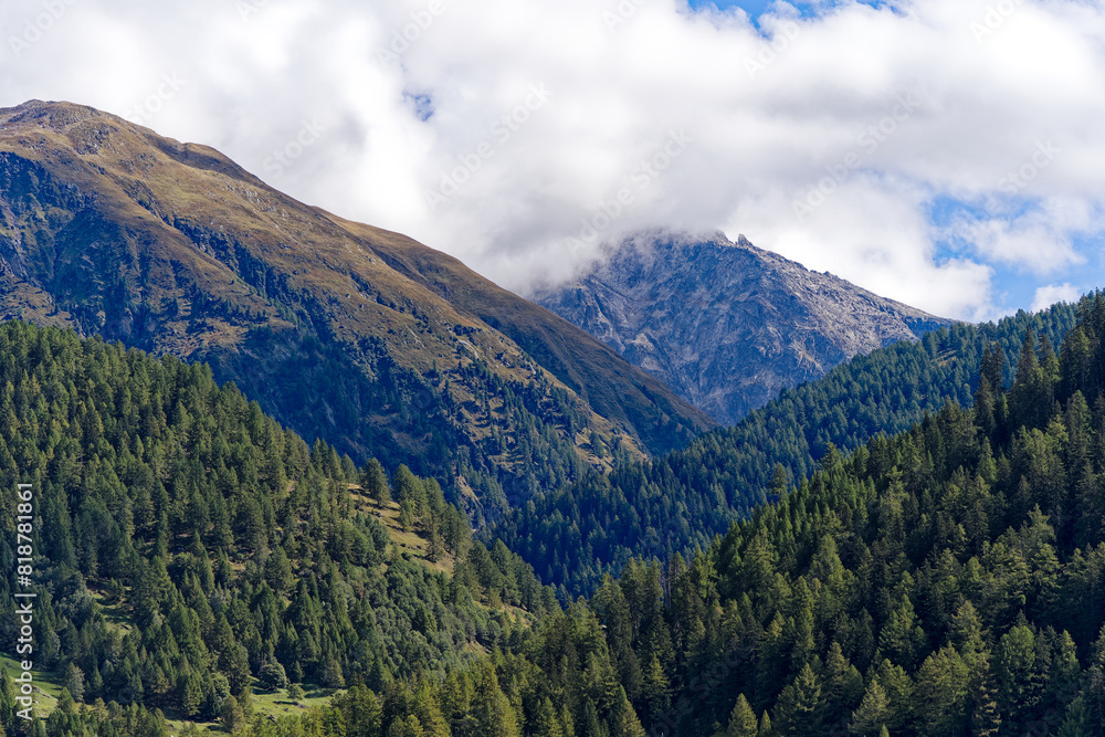 Scenic landscape in the Swiss Alps at mountain village of Oberwald on a sunny late summer day. Photo taken September 19th, 2023, Oberwald, Canton Valais, Switzerland. Scenic landscape in the Swiss Alps at mountain village of Oberwald on a sunny late summer day. Photo taken September 19th, 2023, Oberwald, Canton Valais, Switzerland.