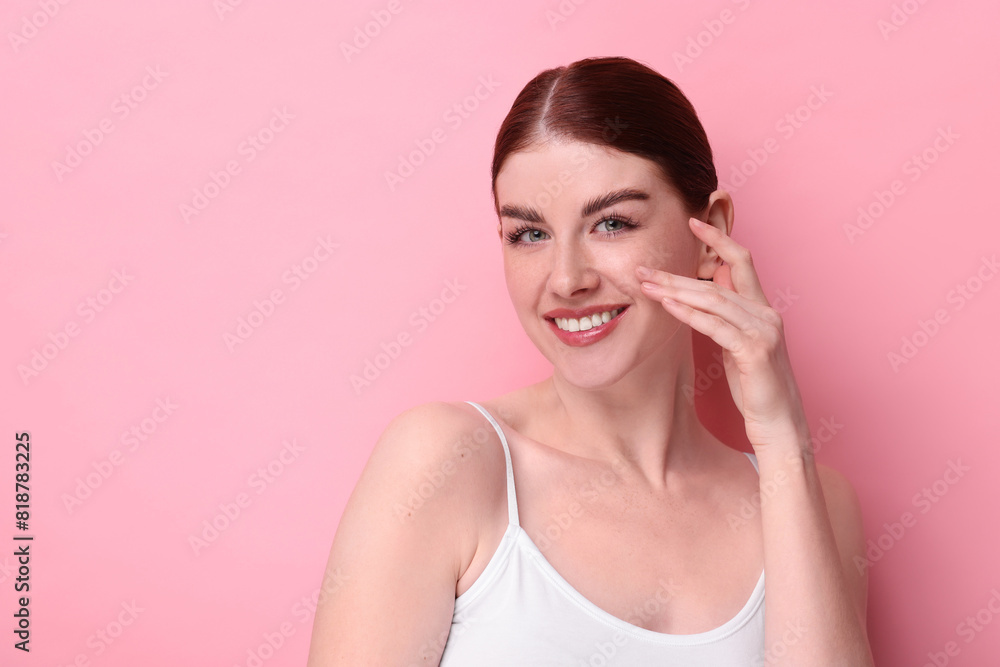 Portrait of smiling woman on pink background. Space for text Portrait of smiling woman on pink background. Space for text