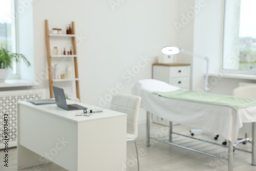 Modern interior of dermatologist's office with examination table © New Africa