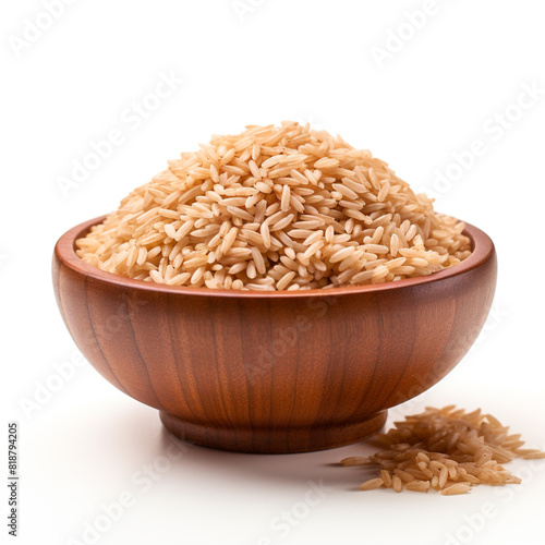 Pile of brown rice brown rice in a wooden bowl isolated on white background