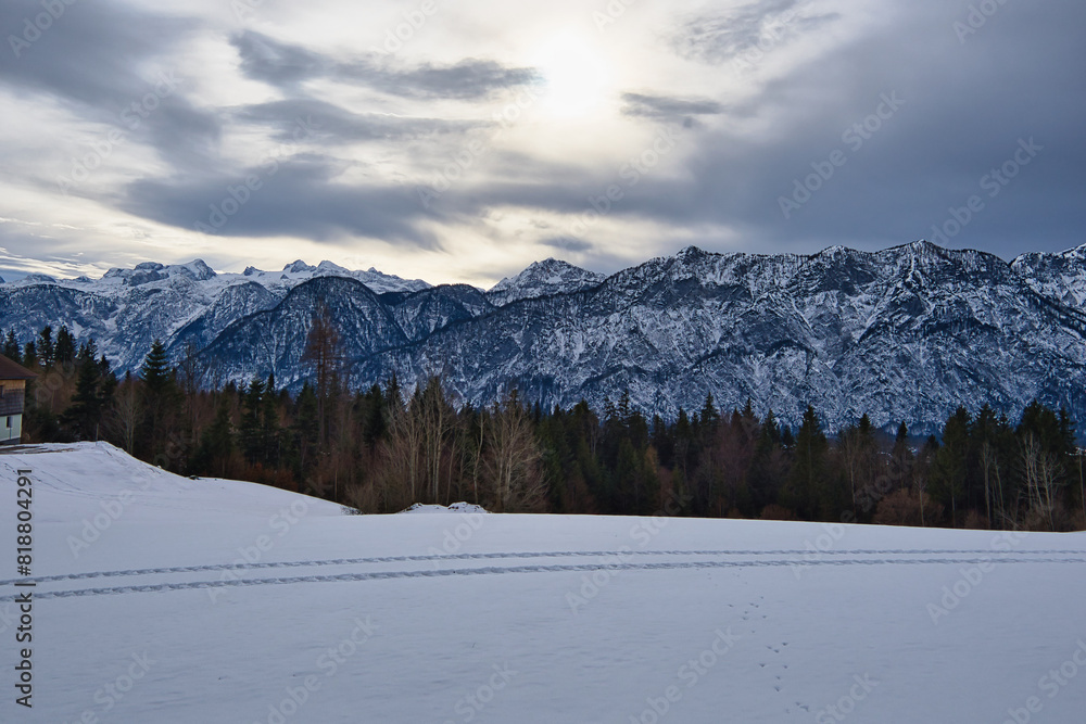 Fototapeta premium Hill with towering mountains in the World Heritage region of Hallstatt Dachstein