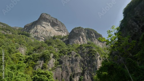 Low angle of the scenery of Xiantao Mountain in Qingtongxia forest park with blue sky, Taibai County photo