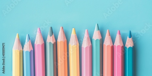 Neatly Arranged Colorful Pencils on Blue Background for Art Projects and Crafts