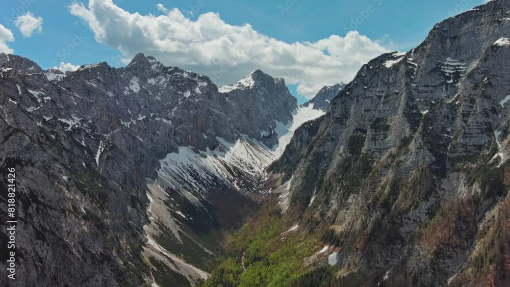 Aerial view of breathtaking peaks and green valley in Julian Alps mountain. Triglav National Park, Slovenia, 4k Aerial view of breathtaking peaks and green valley in Julian Alps mountain. Triglav National Park, Slovenia, 4k