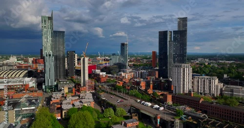 Aerial Manchester cityscape over Deansgate Castlefield showing city buildings and rail transportation  photo