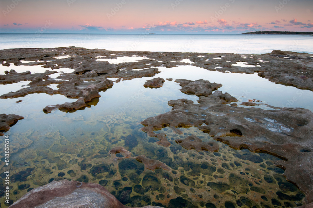 Pools on rock platform at sunset Pools on rock platform at sunset