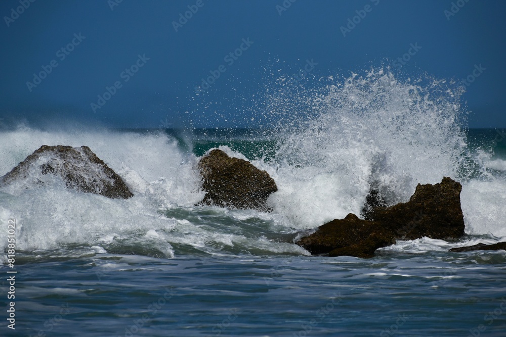 Waves of the sea lapping against the rocks, in a beautiful and wild cove. Waves of the sea lapping against the rocks, in a beautiful and wild cove.