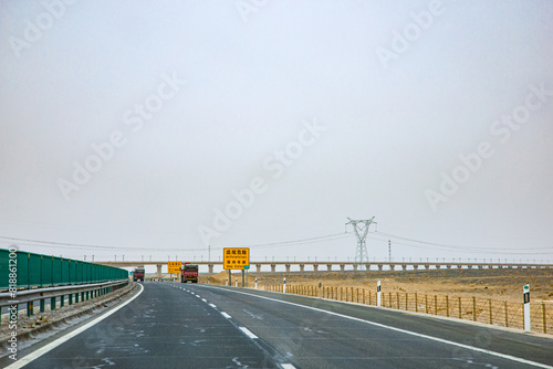 Jiuquan City, Gansu Province - Roads and power generation facilities in the Gobi Desert photo