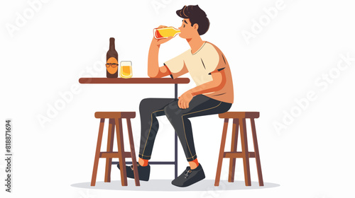 Young man sitting on stool at bar and drinking beer f