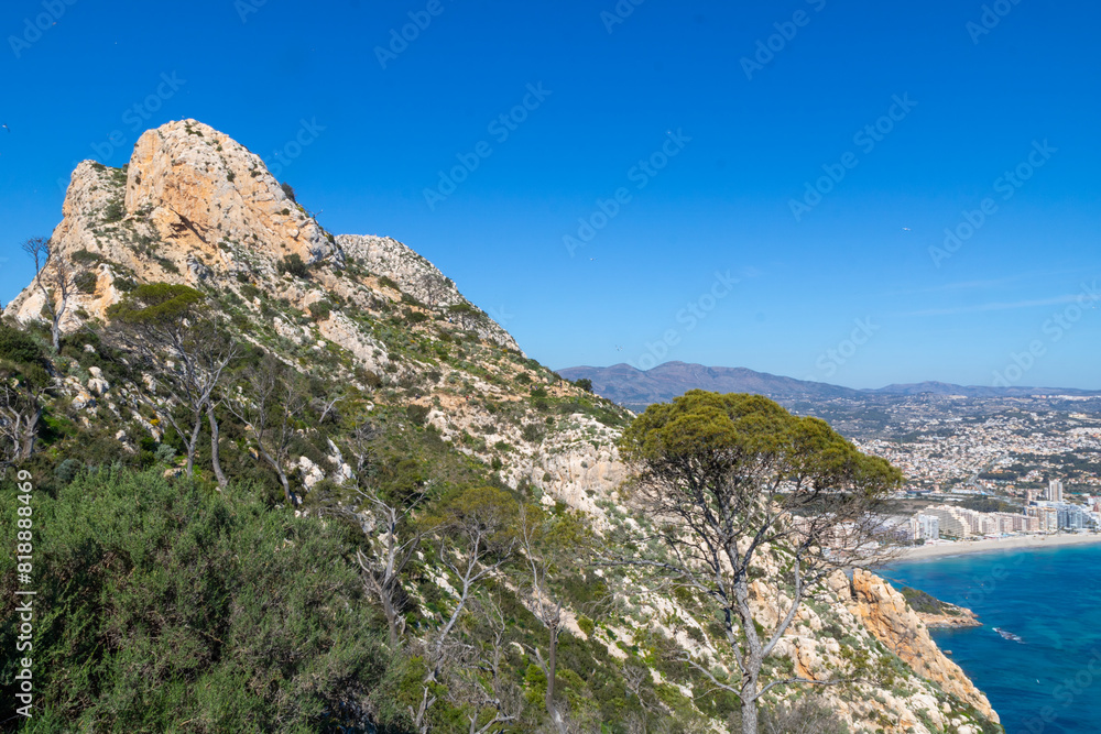 Fototapeta premium Peñón de Ifach Natural Park (Penyal d'Ifac) , Small nature reserve with a large limestone outcrop, trails and panoramic views of Calpe, Mediterranean coast of Alicante and the Gulf of Valencia, Spain.