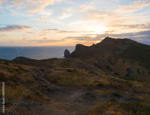 Views of Canical at Cape Ponta de Sao Lourenco, Canical, East coast of Madeira Island, Portugal. Scenic landscape of Atlantic Ocean, rocks and cllifs and cloudy sunrise sky. photo