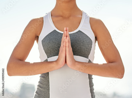 Woman, yoga and praying hands outsides for wellness, spiritual meditation and healing with athlete for balance. Relax, zen and chakara alignment for namaste pose or worship, mindfulness and pilates photo