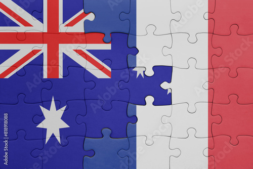 puzzle with the colourful national flag of france and flag of australia. © luzitanija