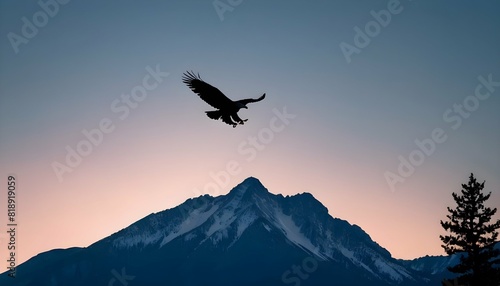 A mountain silhouette with a soaring eagle in the
