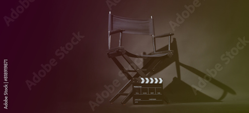 Director chair and Clapper board or slate on black background.