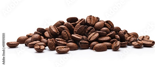 Close up of a pile of roasted coffee beans on a white background providing ample copy space for text