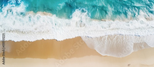 Fototapeta Naklejka Na Ścianę i Meble -  A breathtaking sea landscape with white sand beach and turquoise water seen from a top view captured by a UAV drone Perfect for copy space