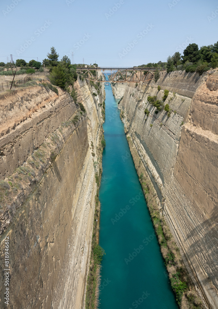The Corinth Canal is an artificial waterway in Greece. It was constructed in the last decade of the 19th century where the Isthmus of Corinth is at its narrowest. The straight canal is approximately 6 The Corinth Canal is an artificial waterway in Greece. It was constructed in the last decade of the 19th century where the Isthmus of Corinth is at its narrowest. The straight canal is approximately 6