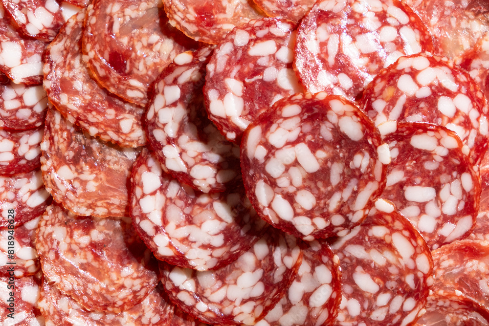 Thin slices of smoked sausage close-up. Thin slices of smoked sausage close-up.