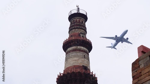 3 Feb 2024- Qutub Minar from Bottom to Top with Passing Flight in the Delhi Sky. photo