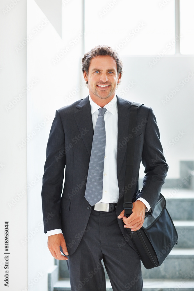 Happy, businessman and walking down stairs in portrait with laptop bag in office for travel. Smile, male person or entrepreneur with luggage for corporate trip or commute to conference or convention Happy, businessman and walking down stairs in portrait with laptop bag in office for travel. Smile, male person or entrepreneur with luggage for corporate trip or commute to conference or convention
