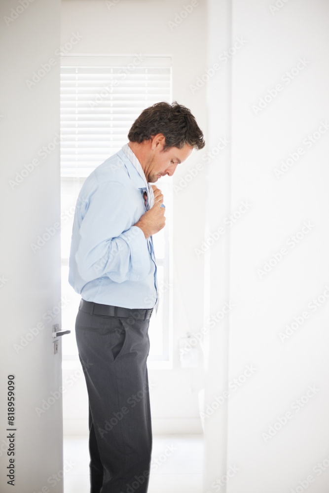 Businessman, dressing and tie for morning routine, getting ready and grooming for work in bathroom. Male person, employee and buttoning shirt with mirror for clothing preparation and fashion